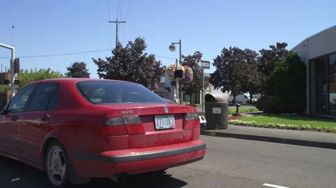 Right Front Three Quarter view of a Driving Plate: Car turns left from SW Canyon Stock Footage 59321112