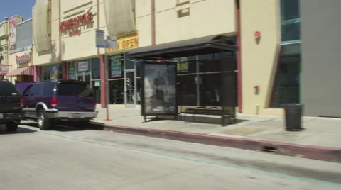 Right Front Three Quarter view of a Driving Plate: Car travels east on Colorado Stock Footage 59332376