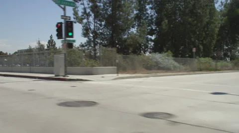 Right Front Three Quarter view of a Driving Plate: Car travels eastbound on West Stock Footage 59333847