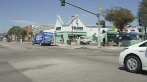 Right Front Three Quarter view of a Driving Plate: Car traveling on Lincoln Stock Footage 59466883