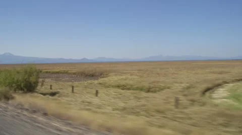 Right Front Three Quarter view of a Driving Plate: Car travels south on Silver Stock Footage 59512624