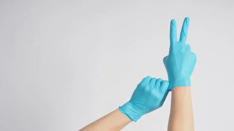 Right hand is doing a good Luck sign.It is hand gesturing two finger with blu Stock Photos