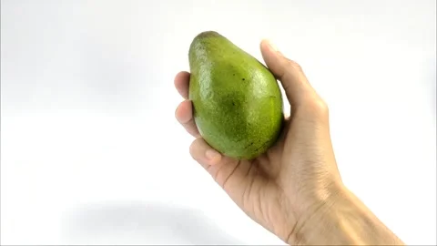 Right Hand Holding An Avocado Stock Footage 297146596