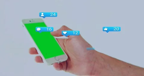 Right hand holding phone, bubble appearing, badges popping, counts rising, Stock Footage 329611275