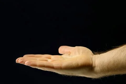Right hand men on a dark background Stock Photos
