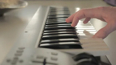 Right hand is playing on a electronic piano Stock Footage 201514308