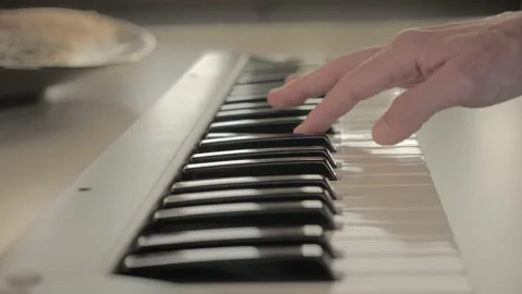 Right hand is playing on a electronic piano Stock Footage 201514309
