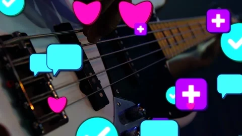 Right hand plucking bass strings, starting social icons floating over instrument Stock Footage 334040589