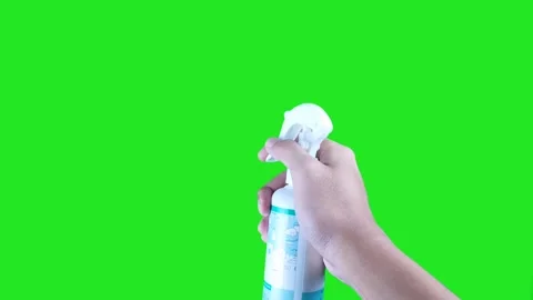 Right hand spraying white cleaning bottle isolated on green screen background Stock Footage 322770789