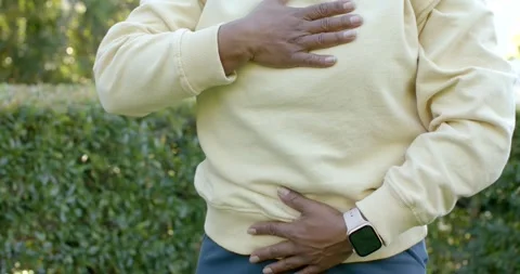 Right hand starting touch, torso in yellow sweater moving left hand to Stock Footage 345589423