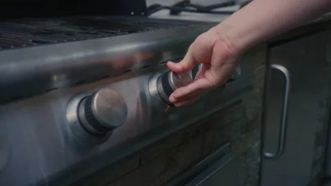 Right Hand Turning Knobs On Large Outdoor Grill. Close Up, Slow Motion 動画素材 220722843
