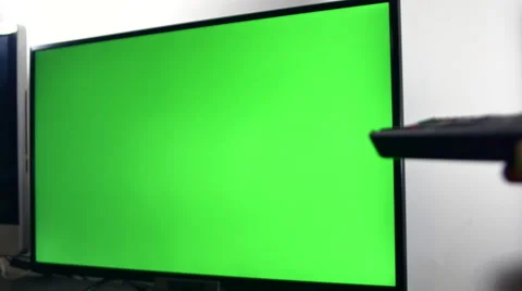 Right Handed Man Searching A Program On His Green Screen TV Set Stock Footage 64045350