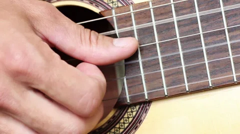 Right human hand plays the guitar bust, closeup Video stock 32226431