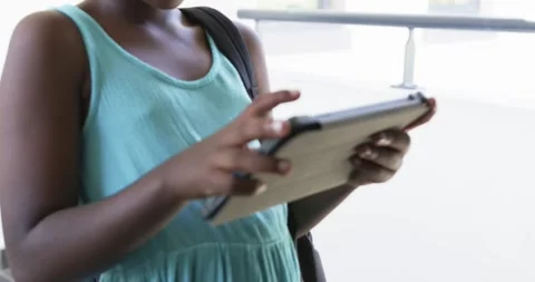 Right index finger is starting taps and swipes while student is steadying tablet Stock-Footage 341665076