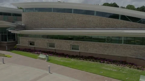 Right to left aerial view of town hall building with flowers Stock Footage 171134526