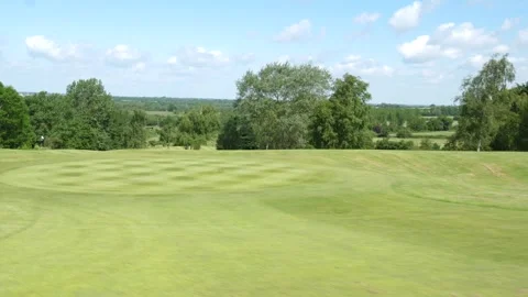 Right to left movement across a golf putting green Stock Footage 288011809