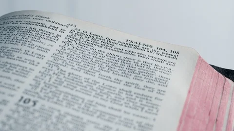 Right to left movement on Bible opened on Psalms Stock Footage 124761119