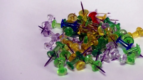 Right to left moving pins on white surface Stock Footage 111887477
