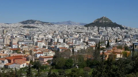 Right to left pan from Acropolis of Athens to city of Athens Mount Lycabettus Video stock 129411074