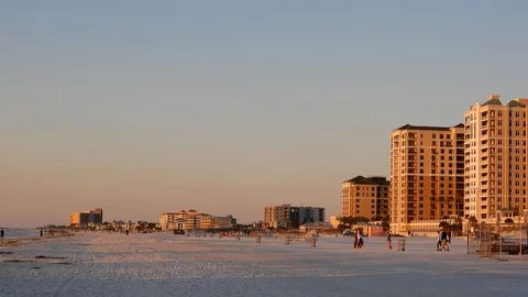 Right To Left Pan Of Beach Resort Buildings At Sunset To People Photographer Stock Footage 127249748