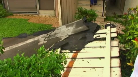 Right to Left Pan Blown Down Fence after Hurricane Wilma Stock Footage 291000294