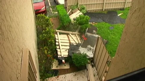 Right to Left Pan Blown Down Fence after Hurricane Wilma Stock Footage 291000307