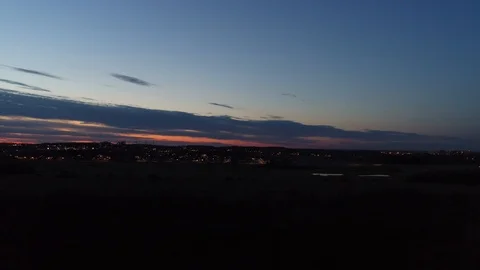 Right To Left Pan Of City Lights Sunset Aerial Drone Stock-Footage 121205252