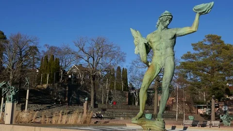 Right to left pan in a garden full of tall statues Stock Footage 75044453