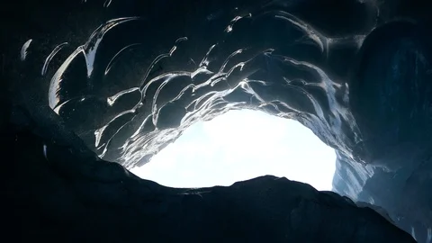 Right to left pan inside a blue ice cave Stock Footage 93969171