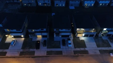 Right To Left Pan Over Expensive Houses At Night With People Walking On Side Stock-Footage 121205064