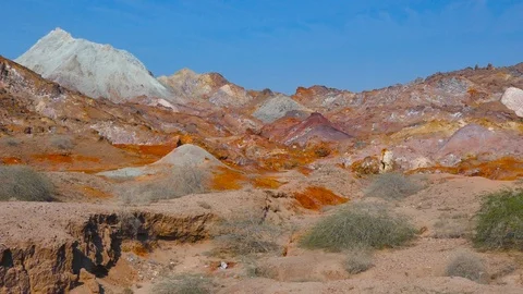 Right to left pan over stunning scenery colorful rainbow mountains with blue sky Stock Footage 111682743