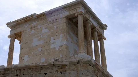 Right to left pan from over the temple of Athena inside the Acropolis of Athens Stock Footage 129411930