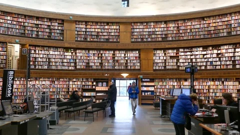 Right to left pan people inside National Library of Sweden Kungliga biblioteket Stock Footage 112079095
