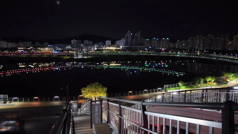 Right to Left Pan of Sejong Skyline and Geumgang Pedestrian Bridge Reflection Stock Footage 311724996