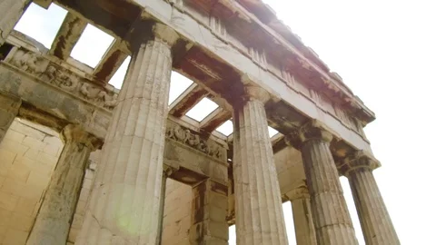Right to left pan tilt camera moves around Temple of Hephaestus in roman agora Stock Footage 92439510