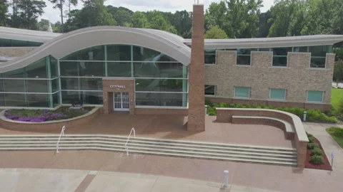 Right to left pan view of well landscape city hall Stock Footage 171134991