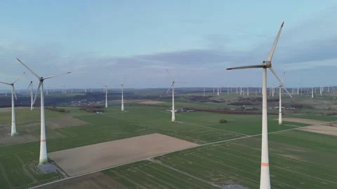 Right to left sunset pass across the full wind farm Stock Footage 331215292