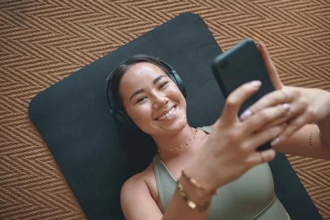 The right music makes all the difference to your fitness game. Portrait of a Stock Photos