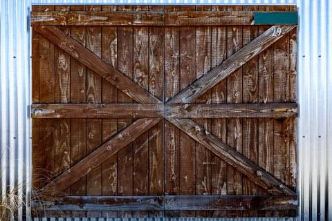 A Right Old Rustic Barn Door on a TIn Shed Stock Photos