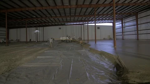 Right Pan of Construction Workers Working Wet Concrete Stock Footage 101390475