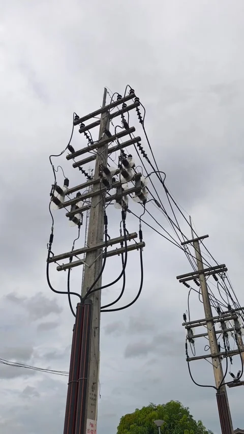 Right pan of electrical riser pole connecting overhead to underground power. Video stock 333394991