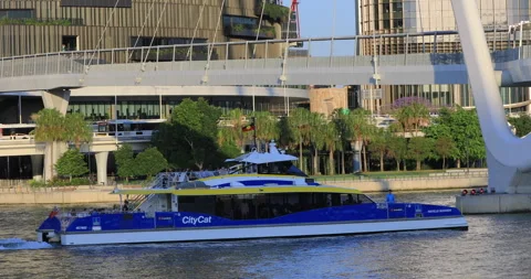 Right pan motion of ferry under bridge at Brisbane CBD, QLD, 10-17-2025 Stock Footage 320172310