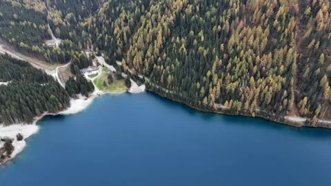 Right panning above Antholzer See from "Platzl am See" to Antholzer Wildsee Haus Stock Footage 323572920