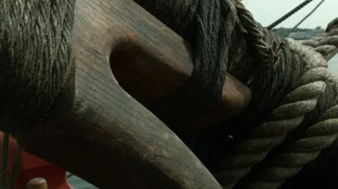 A right panning shot aboard a docked sailing ship with ropes masts and spars 库存影片 61267152