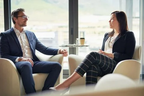 The right partner can make all the difference. two businesspeople talking in a Stock Photos