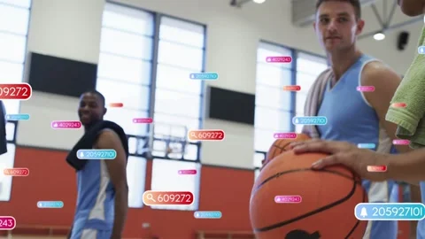 Right player holding ball while teammate pushing ball data tags rising over Stock Footage 334013951