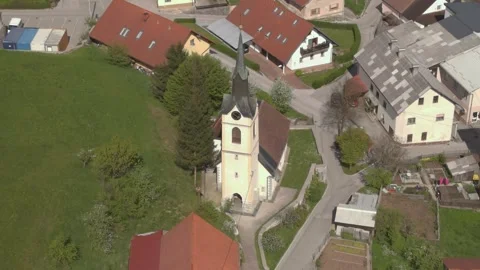 Right Side Drone Orbit of Small Church with Clock in Logatec, Slovenia Vidéo 308071697