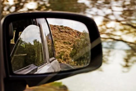 Right side mirror in the car during the day Stock Photos
