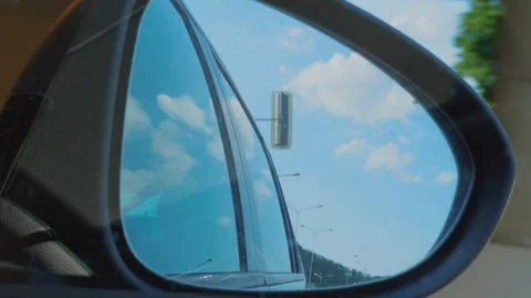 Right side rear view mirror at driving from light to tunnel Stock Footage 109604065