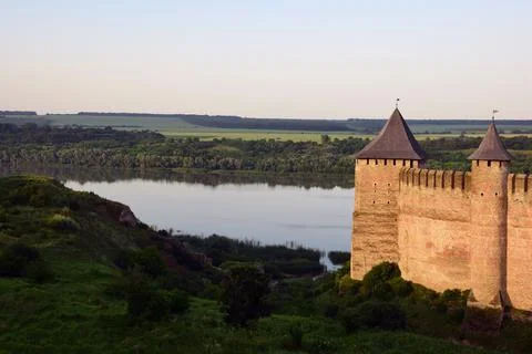 On the right side of the tower of a medieval stone fortress with battlements Stock Photos